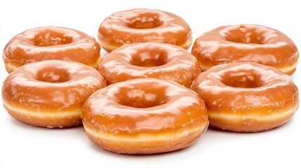 Freshly glazed donuts arranged in a circular pattern, showcasing their shiny surface and texture