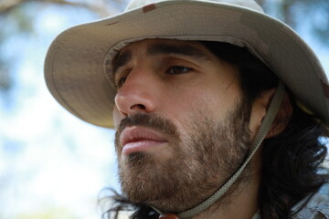 Sad Serviceman Sitting On The Ground In The Countryside Reflects On Memorial Day