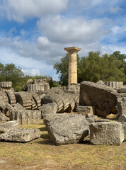 Olympia, Greece - July 4, 2024: Birthplace of the Olympic Games. Heap of column pieces in front of...