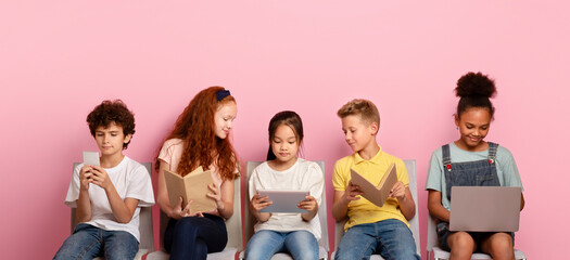 Elearning concept. Diverse schoolchildren using tablet, laptop, smartphone and books to study online on chairs over pink background