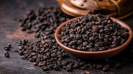 Fototapeta premium Natural Black Coffee Beans in Wooden Bowl on Rustic Table Background