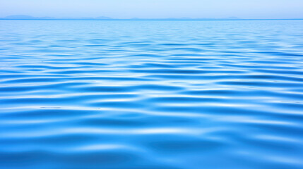 Naklejka premium Calm blue ocean water with gentle ripples and serene atmosphere