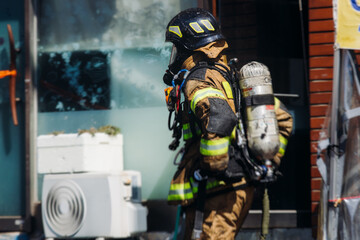 Group of South Korean fire men during fire fighting operation in the streets, firefighters with fire engine truck vehicle, 911 emergency and rescue, fire drill, exercise training, Busan, South Kore