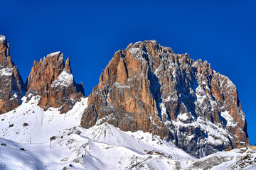 Beautiful panoramic view to the Sellaronda - the ski circuit around the Sella group in Dolomites, Italy - Badia, Gherdeina, Fascia. Extraordinary snowy peaks of the dolomites, southern Alps.