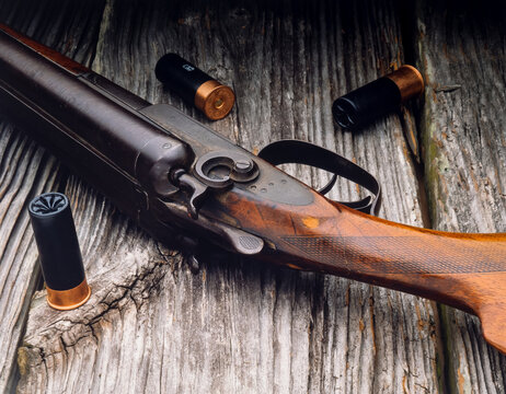 old double barrel shotgun and shells