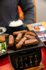 a Japanese grill with beef cutlets 