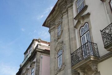 Ornate facade, intricate windows, and graceful balconies adorn this Baroque masterpiece in Braga, Portugal. A testament to Portugal's rich history preserved in stone.