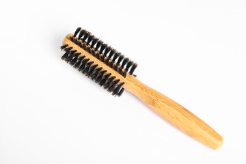 Hairdresser tool. Round wooden brush on white background, top view