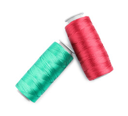 Spools of bright sewing threads isolated on white, top view