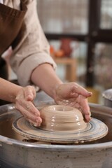 Hobby and craft. Woman making pottery indoors, closeup