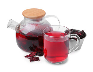 Delicious hibiscus tea in glass cup, teapot and dry roselle sepals isolated on white