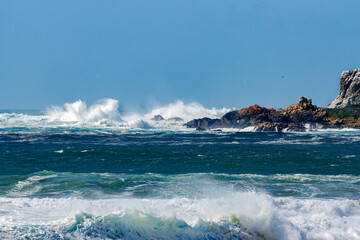 Spectacular splashes as wind driven waves strike Piedras Blancas Lightstation.