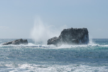 Spectacular splashes explode as wind driven waves strike rock 2 in Piedras Blancas State Marine Reserve.