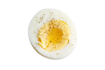 Close up of a hard boiled egg with a sprinkle of pepper on top, isolated