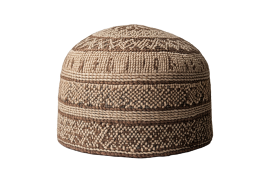 Tan and brown knitted hat with a pattern of dots, isolated