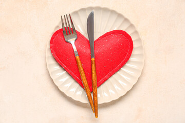 Beautiful table setting for Valentine's Day with heart on beige grunge background