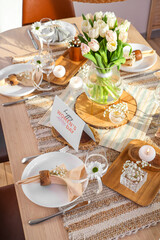 Stylish table setting with tulips for International Women's Day celebration