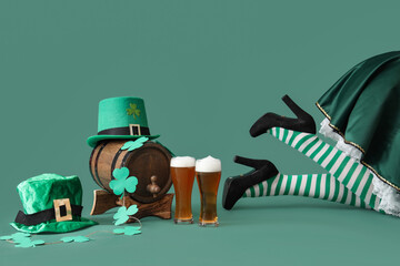Woman in waitress costume with glasses of beer, leprechaun's hats, barrel and clovers on green...