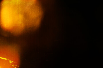 Designed film texture background with heavy grain, dust and a light leak