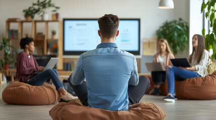 Students in flipped classroom using laptops for collaborative learning