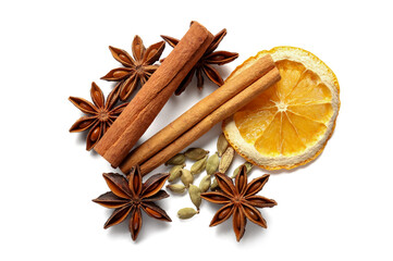 Anise stars with cinnamon and slice of dried orange on white background