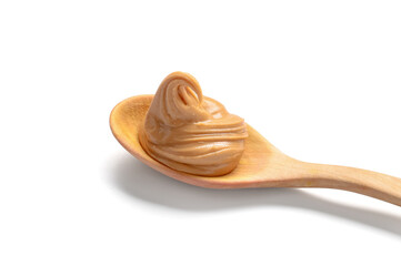 Wooden spoon with tasty peanut butter on white background