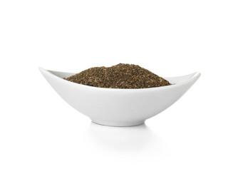 Bowl of black pepper powder on white background