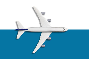 Miniature model airplane on blue and white pastel color background, flat lay design