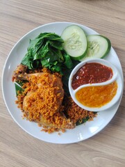 chicken serundeng with boiled cassava leaves