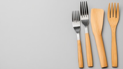 Assortment of Different Forks and Spatula on a Light Background