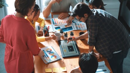 Top view of manager writing idea on sticky notes and explain idea about web design. Professional...