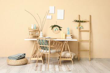 Interior of office decorated for Easter with workplace and ladder