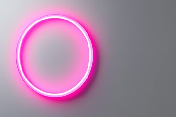 Pink neon circle on grey wall, glowing, modern design. Perfect for backgrounds, promotional material, or stylish concepts.