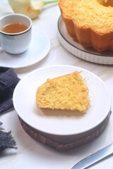 a slice of cake Tape or Fermented Cassava Cake in white plate cake on white background
