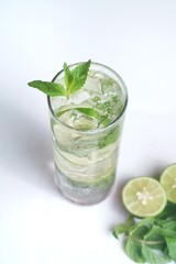 iced lime soda with mint - refreshing drink isolates on white background

