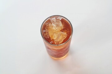 a glass of ice tea isolated on white background
