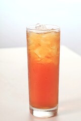 a glass of ice tea isolated on white background
