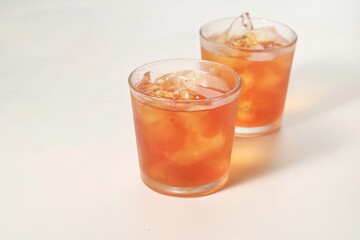 a glass of ice tea isolated on white background
