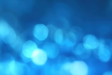 Obraz premium Abstract blue bokeh background with blurred lights.
