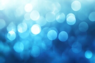 Abstract blue bokeh background with bright lights and blurry circles.