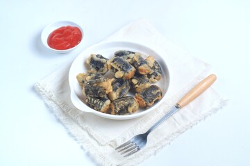 Chicken Nori Seaweed Roll is chicken dough with spices rolled in seaweed, then fried. served with sauce. Isolated on white plate
