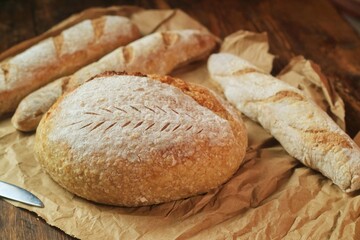 Country loaf sourdough bread on woodden table. Fresh fragrant bread on the table. Food concept. Healthy Food.
