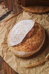 Country loaf sourdough bread on woodden table. Fresh fragrant bread on the table. Food concept. Healthy Food.

