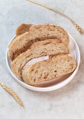 Country loaf sourdough bread on woodden table. Fresh fragrant bread on the table. Food concept. Healthy Food.
