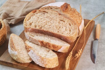 Country loaf sourdough bread on woodden table. Fresh fragrant bread on the table. Food concept. Healthy Food.
