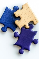 Fototapeta premium Three Puzzle Pieces Two Blue One Tan on White Background
