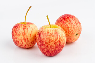 Small red apple on white background