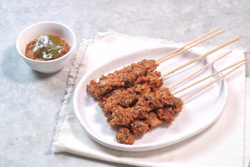Clam Satay. Sate Kerang. Made from clams, chili, garlic, salt, spices and coconut. 
