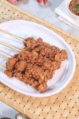 Clam Satay. Sate Kerang. Made from clams, chili, garlic, salt, spices and coconut. 
