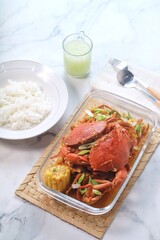 Delicious Crab in Padang sauce or an Indonesian seafood dish of crab served in hot and spicy Padang sauce with corn.
